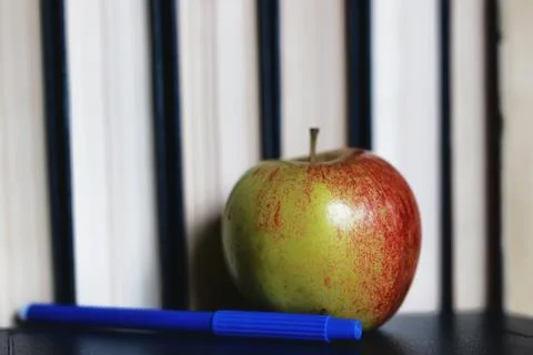 Education concept books stack, apple and pen Stock Photos