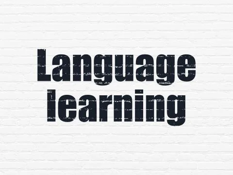 Education concept: Language Learning on wall background Illustrazione stock