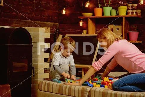 Education concept. Little child play educational game with woman, education Stock Photos