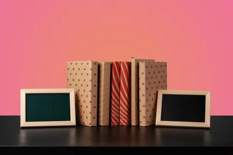 Education concept with stack of books on a table against colored background. Foto stock