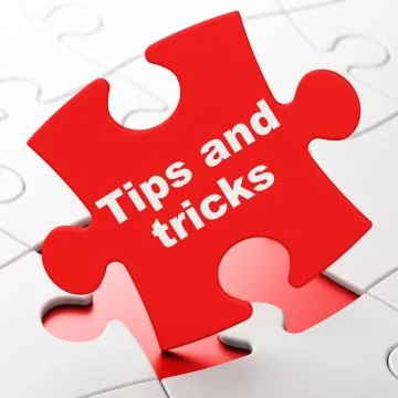 Education concept: Tips And Tricks on puzzle background Illustrazione stock