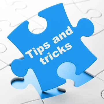 Education concept: Tips And Tricks on puzzle background Illustrazione stock