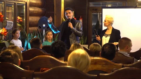 Education event - presenting something to group of kids at educational event Stock Footage 107874696