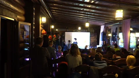 Education event - presenting something to group of kids at educational event Stock Footage 107874720