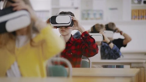 Education of future. View of excited young students wearing virtual reality Video stock 111970045