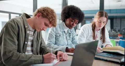 Education, laptop and study group with student friends in library of college or Stock Footage 280836937