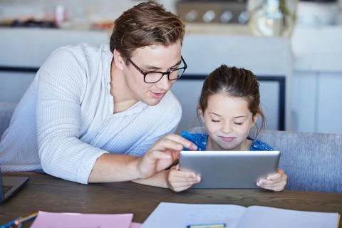 Education, learning and child development on digital tablet with father and 库存照片