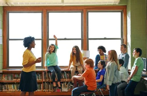 Education, learning and student with questions for teacher in middle school Stock Photos