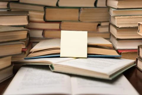 Education learning concept with open book and notebook on the table. Stack pi Stock Photos