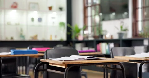 Education, notebook and desk in school for learning, study material or research Stock Footage 347901151