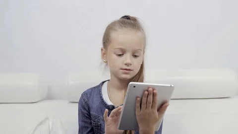 Education, school, technology and internet concept - little student girl with Stock Footage 82546891