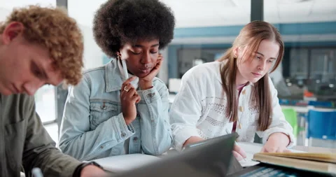 Education, study group and writing with student friends in library of college or Stock Footage 280839424