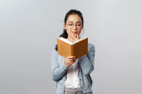 Education, teachers, university and schools concept. Intrigued smart good Stock Photos