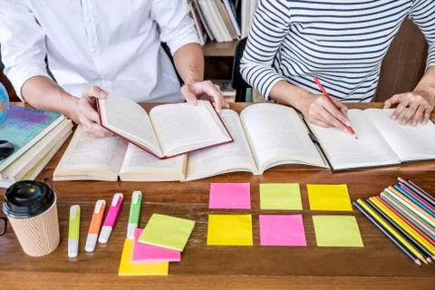 Education, teaching, learning concept. Two high school students or classmates Stock Photos