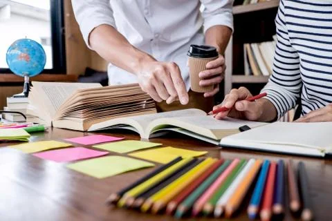 Education, teaching, learning concept. Two high school students or classmates Stock Photos