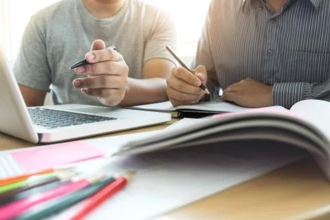 Education, teaching, learning, technology and people concept. Two high school Stock Photos