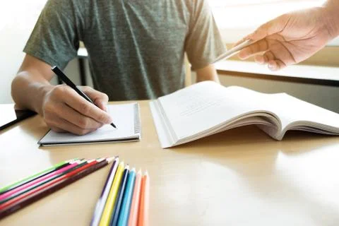 Education, teaching, learning, technology and people concept. Two high school Stock Photos