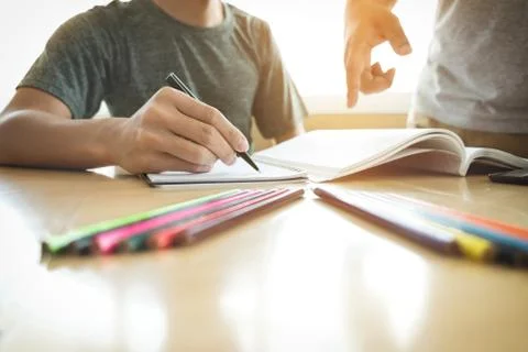 Education, teaching, learning, technology and people concept. Two high school Stock Photos