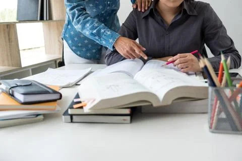 Education, teaching, learning, technology and people concept. Two high school Stock Photos