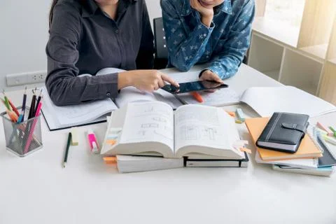 Education, teaching, learning, technology and people concept. Two high school Stock Photos