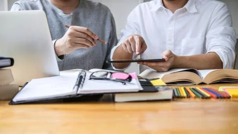 Education, teaching, learning, technology and people concept. Two high school Stock Photos