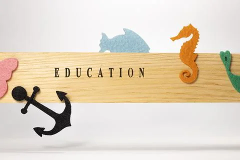 Education written on wooden patterned surface. Education and child psychology Stock Photos