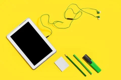 Educational accessories on a yellow surface Stock Photos