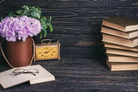 Educational background. Composition from books, old watche, flowers and glasses Stock Photos