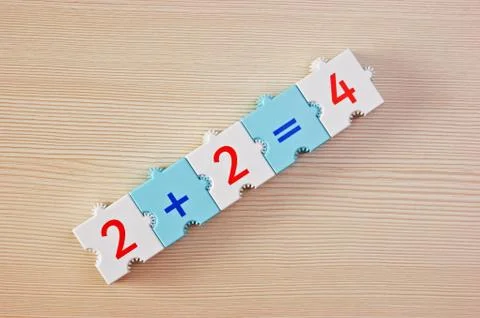 Educational blocks with math problems on the table 스톡 사진