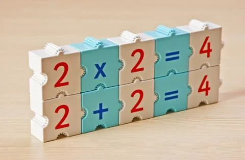 Educational blocks with math problems on the table Stock Photos