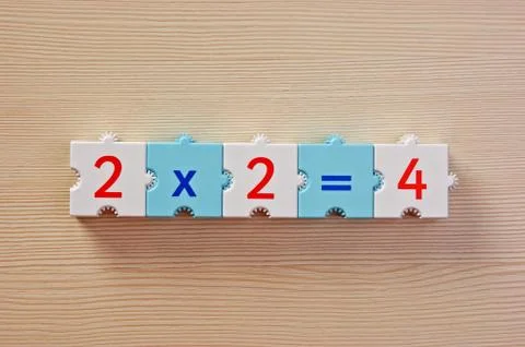 Educational blocks with math problems on the table 写真素材