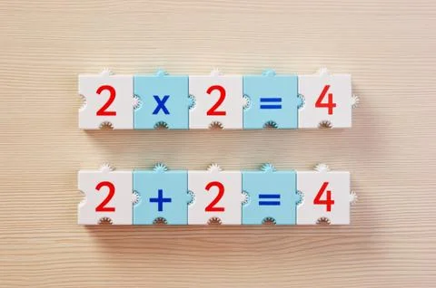 Educational blocks with math problems on the table Stock Photos