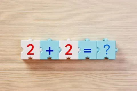 Educational blocks with math problems on the table Foto stock