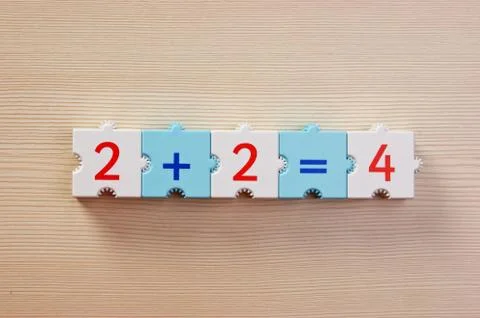 Educational blocks with math problems on the table 스톡 사진