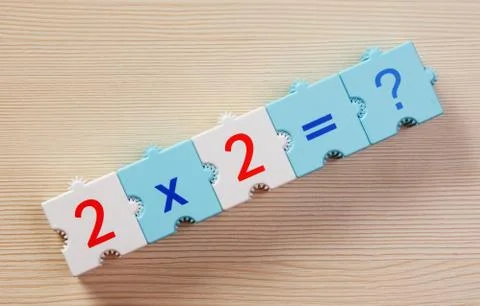 Educational blocks with math problems on the table Stock Photos