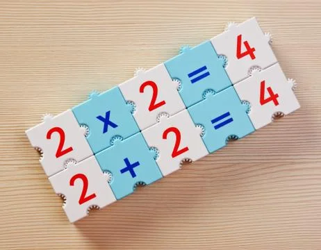Educational blocks with math problems on the table Stock Photos