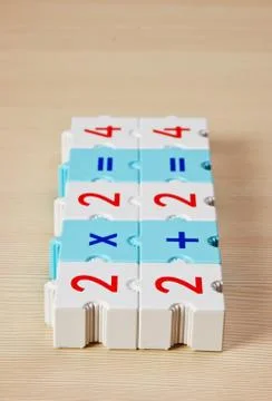 Educational blocks with math problems on the table Foto stock