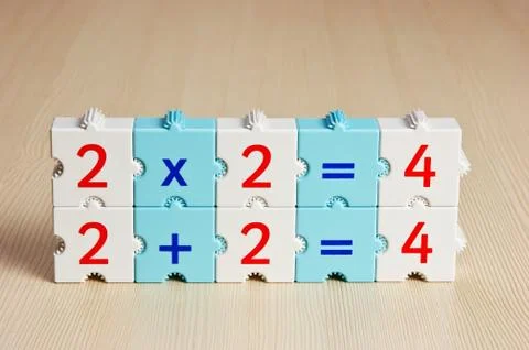 Educational blocks with math problems on the table Stock Photos