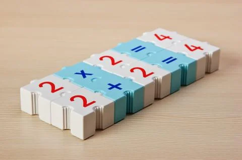 Educational blocks with math problems on the table 스톡 사진