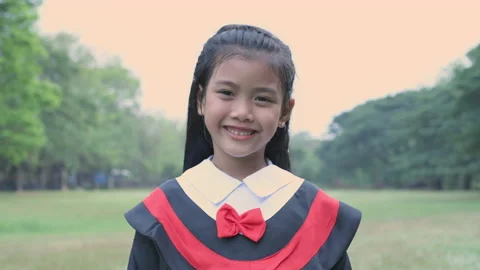 Educational concept of 4k Resolution. Asian girl in graduation gown smiling.. Stock Footage 233915065
