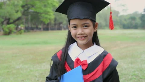 Educational concept of 4k Resolution. Asian girl in graduation gown smiling.. Stock Footage 233915439