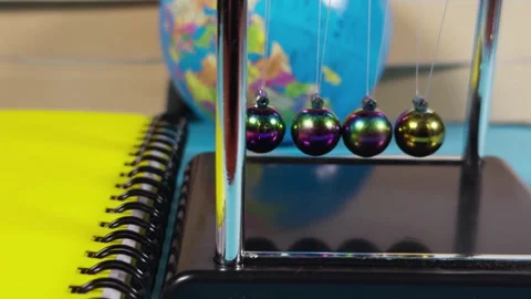 Educational Concept Newtons Cradle and School Office Equipment Tools Stock Footage 308378437
