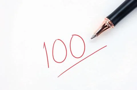 Educational concept, pen with written in red ink on white paper.  Stock Photos