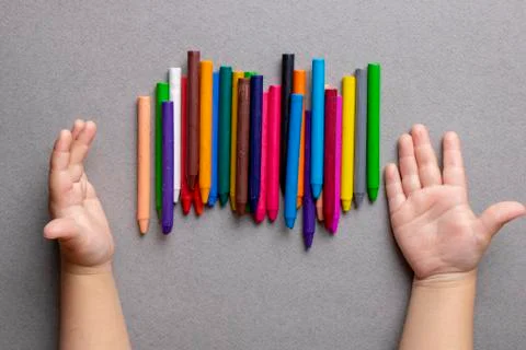 Educational development for children. Crayons on paper, flat lay Stock Photos