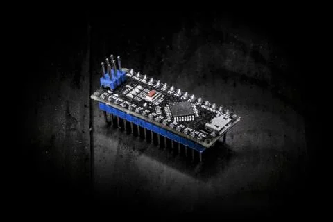 Educational microcontroller Board arduino on black background Stock Photos