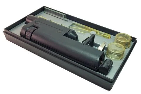 Educational microscope in portable case for storing with tools and asseseor.. Stock Photos