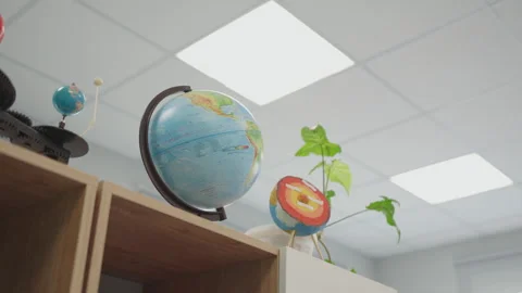 Educational models for science lessons stand on cabinet tops Stock Footage 335643924