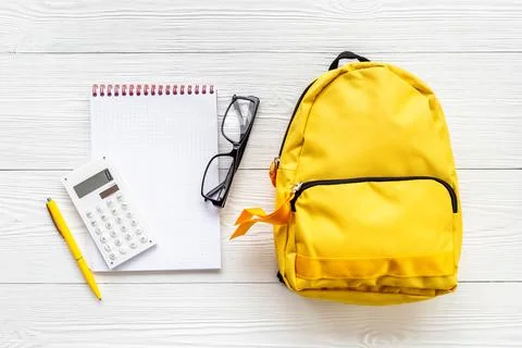 Educational objects top view. School backpack with colorful stationery Stock Photos