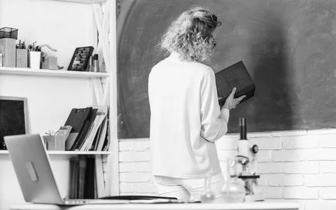 Educational program for primary school. Girl adorable teacher in classroom Stock Photos