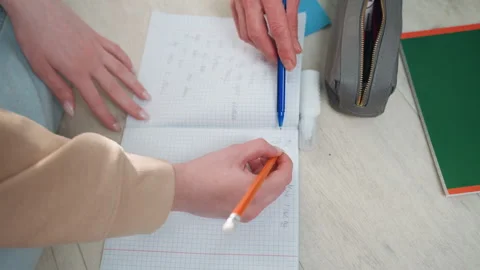 Educational session with teacher providing feedback and corrections. Learning Stock Footage 341977737